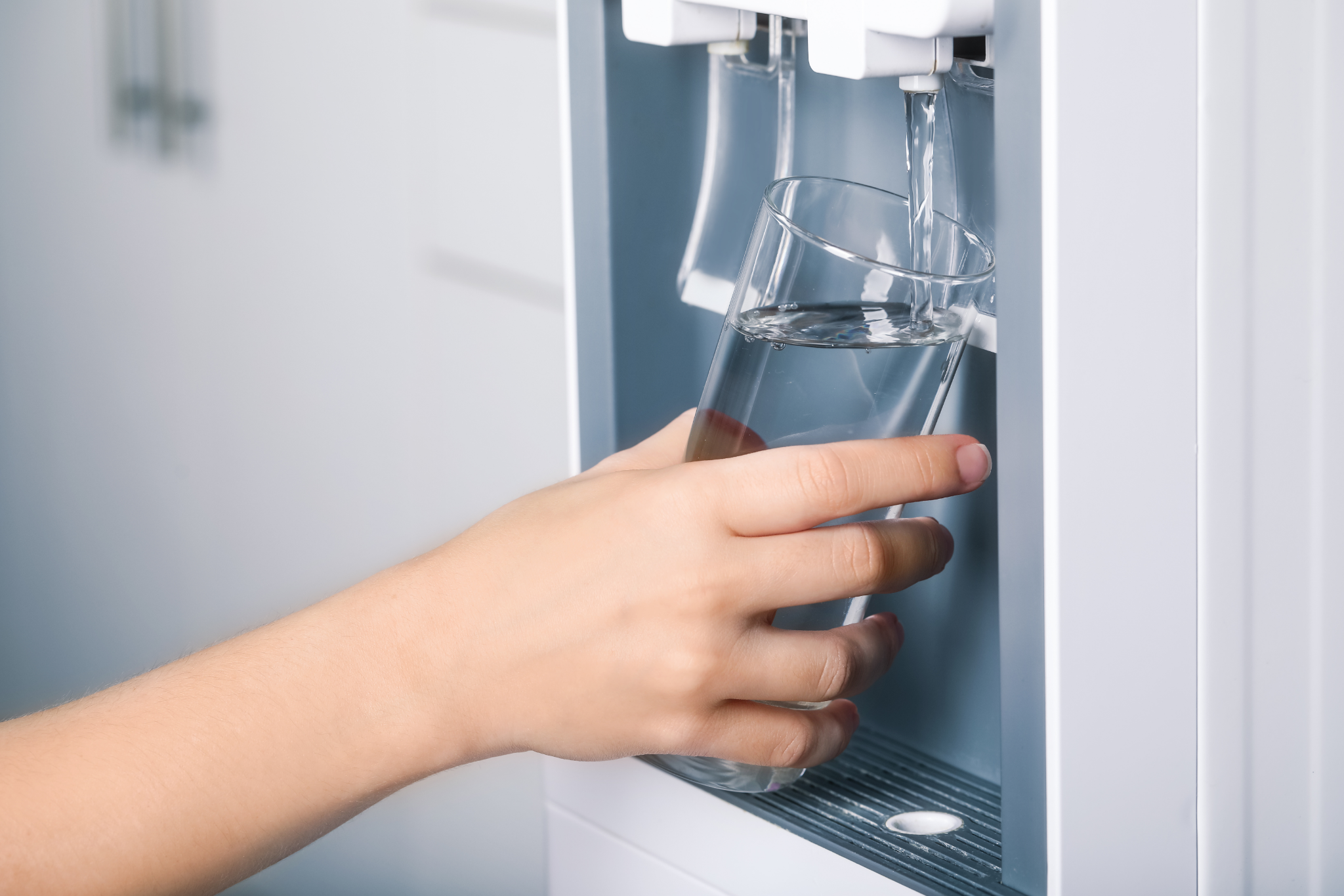 Person dispensing water from Nevada Crystal Premium