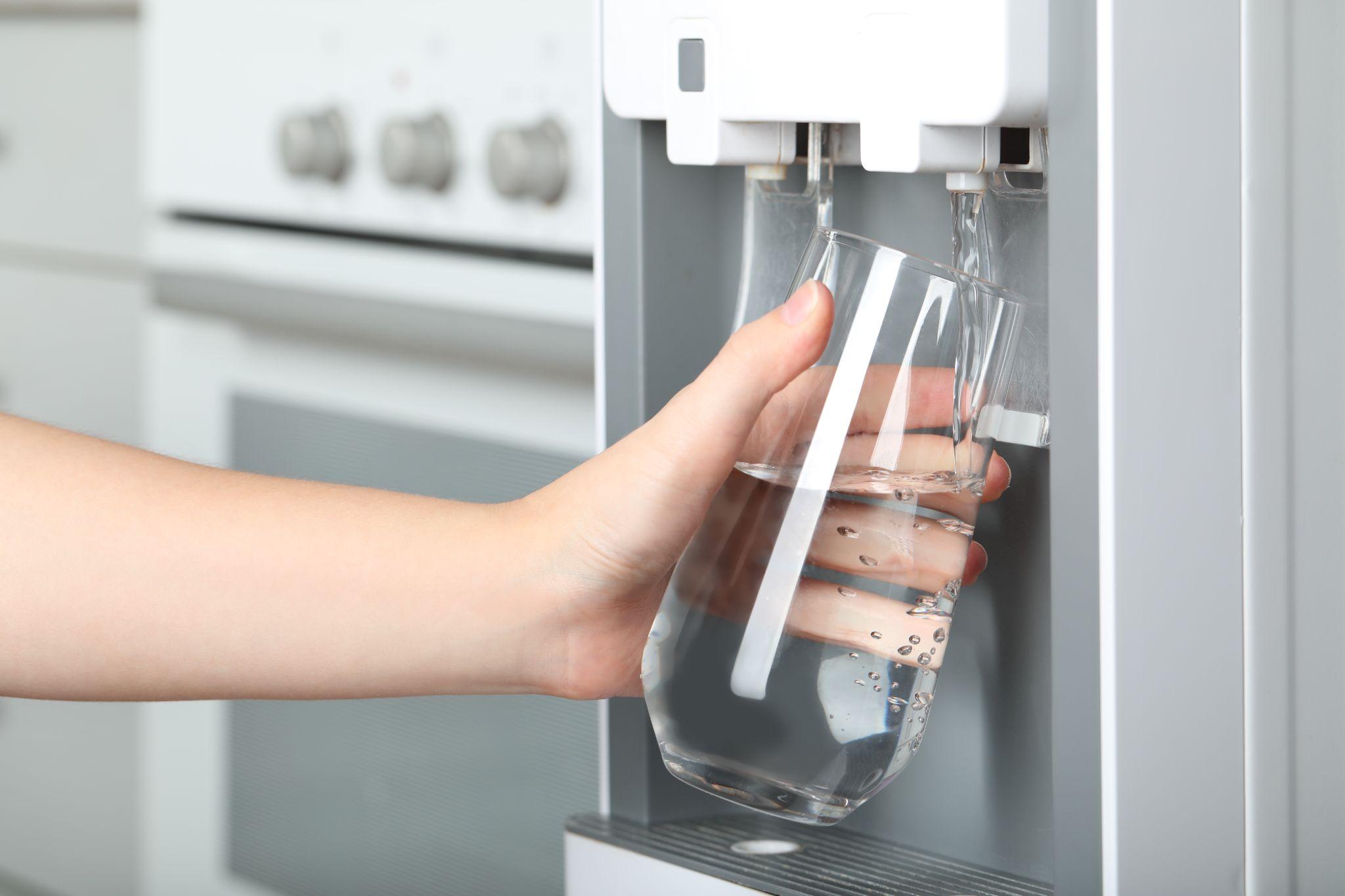 Pouring water from a Nevada Crystal Premium water cooler