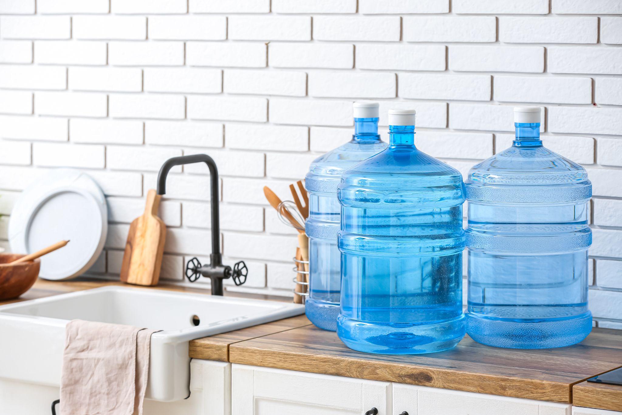 5 gallon water jugs from Nevada Crystal Premium sitting on a kitchen counter
