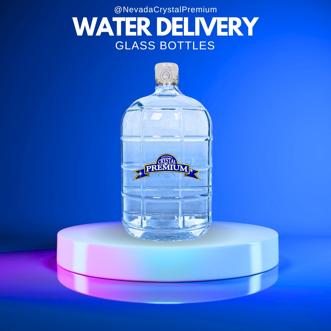 Large glass bottle of Crystal Premium water displayed on a lit circular platform with the text "Water Delivery Glass Bottles" above it on a blue background.